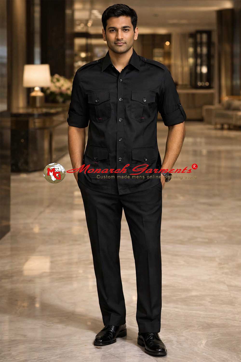 Indian male model wearing premium black cotton safari shirt with four pockets by Monarch Garments in luxury hotel lobby photoshoot