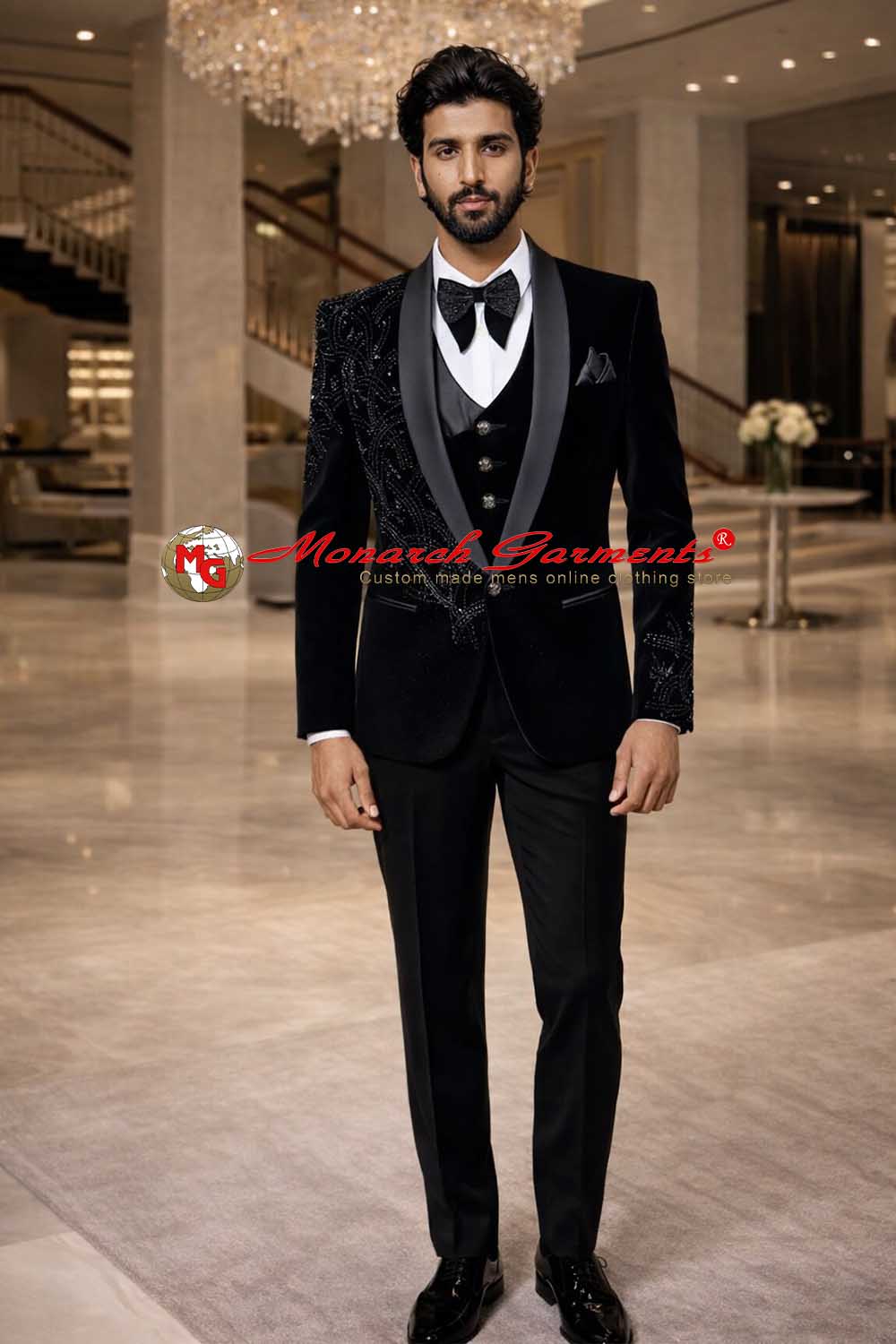 Black embroidered tuxedo suit for men with satin lapel and slim fit styling for weddings in India