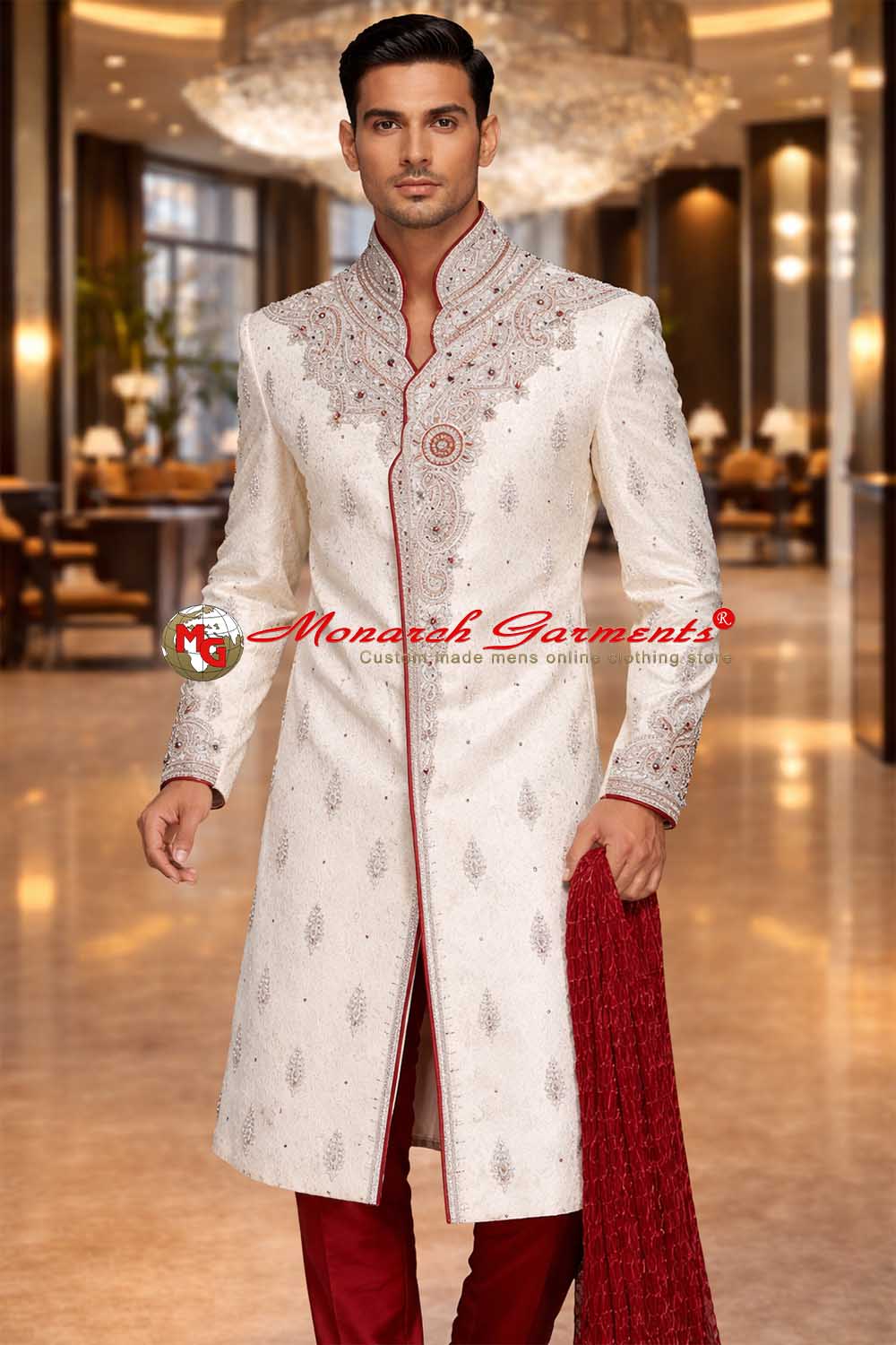 Cream embroidered wedding sherwani for men with red accents and bandhgala collar by Monarch Garments India