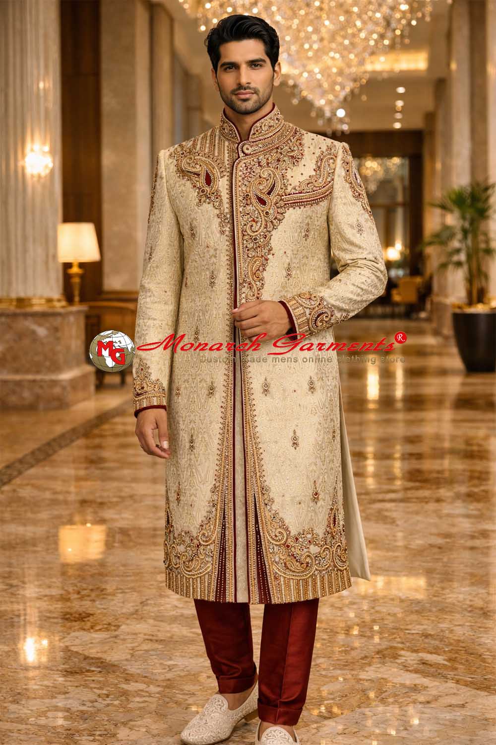 Indian groom wearing cream embroidered wedding sherwani with maroon accents by Monarch Garments