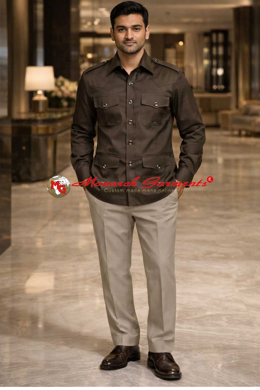 Indian male model wearing dark olive cotton safari shirt with four pockets by Monarch Garments in luxury hotel lobby photoshoot