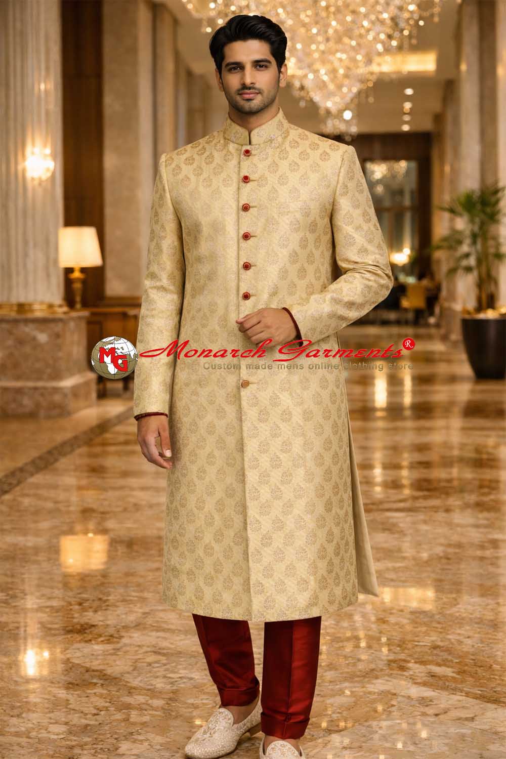 Indian groom wearing gold brocade wedding sherwani with red buttons by Monarch Garments