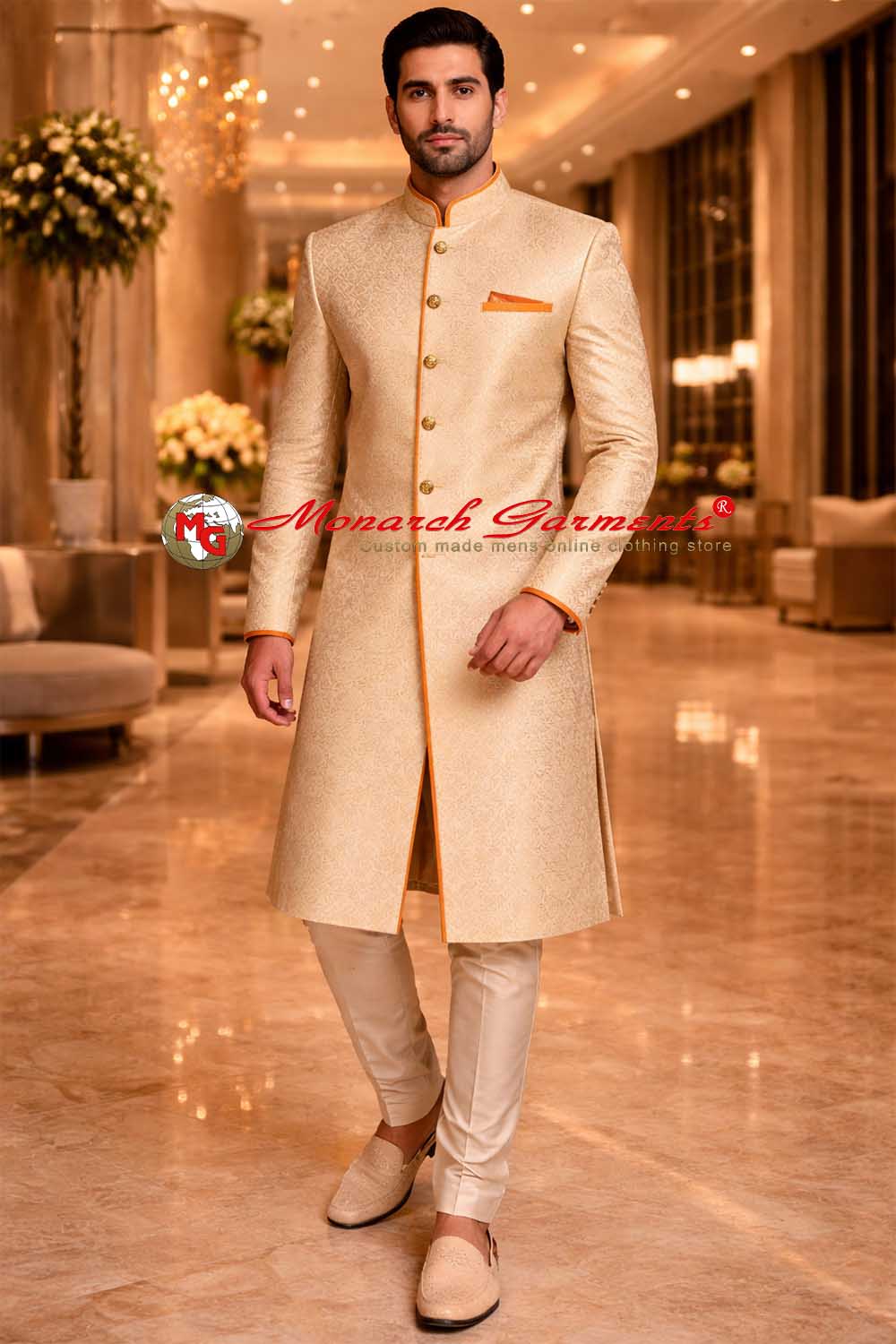 Golden brocade groom sherwani with orange piping detail and matching dupion silk pyjama
