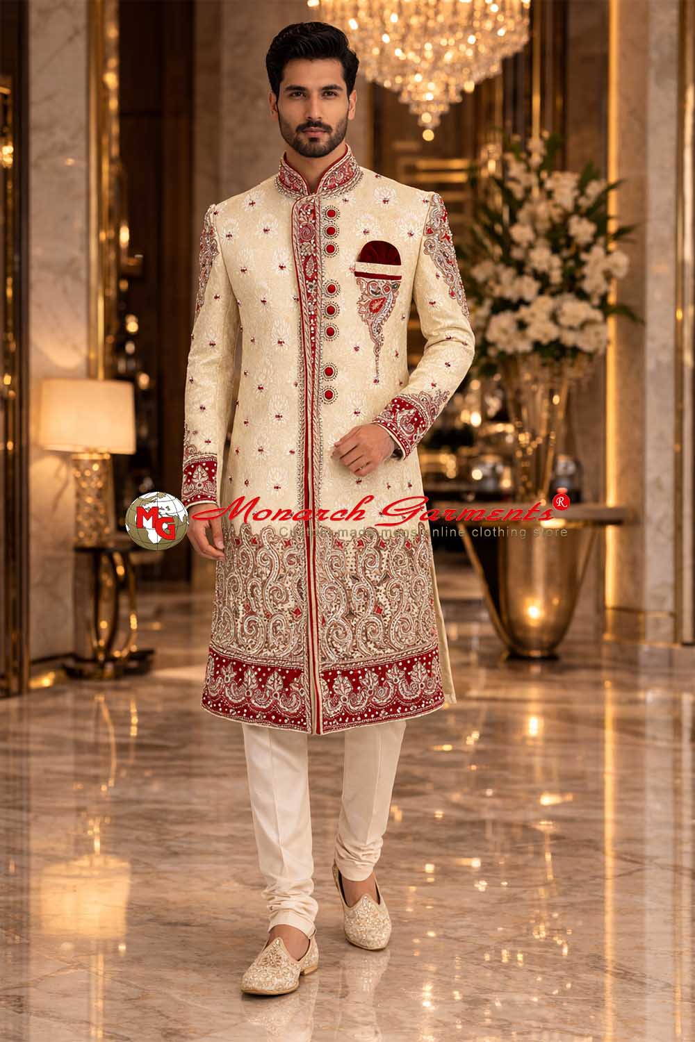 Indian groom wearing ivory brocade embroidered wedding sherwani with red detailing by Monarch Garments