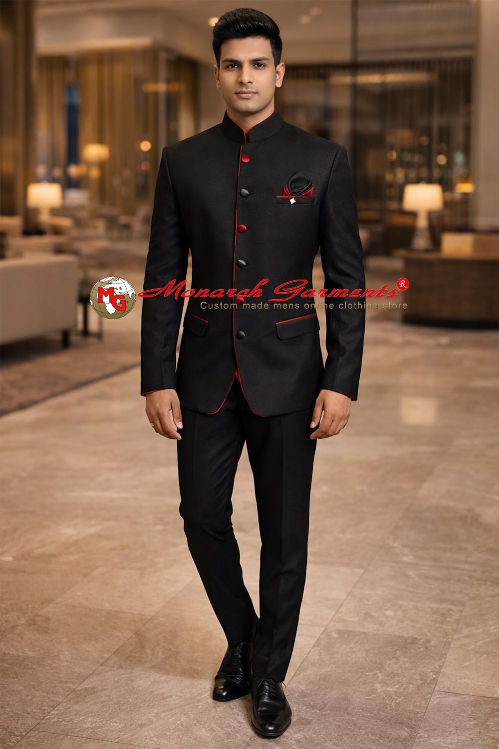 Man wearing black Nehru collar tuxedo suit with red detailing and black trouser for wedding and formal occasions