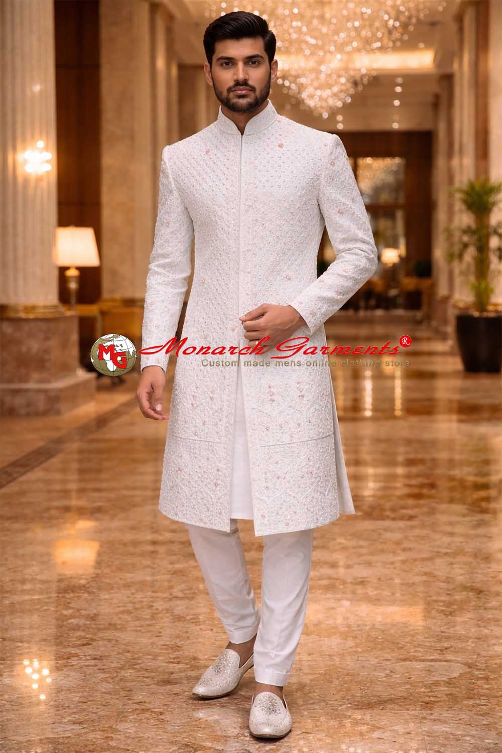 Indian groom wearing white embroidered polyester wedding sherwani by Monarch Garments